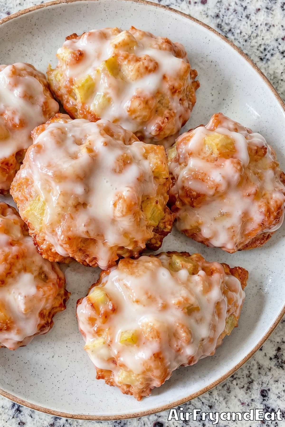 Easy air fryer apple fritters stacked high