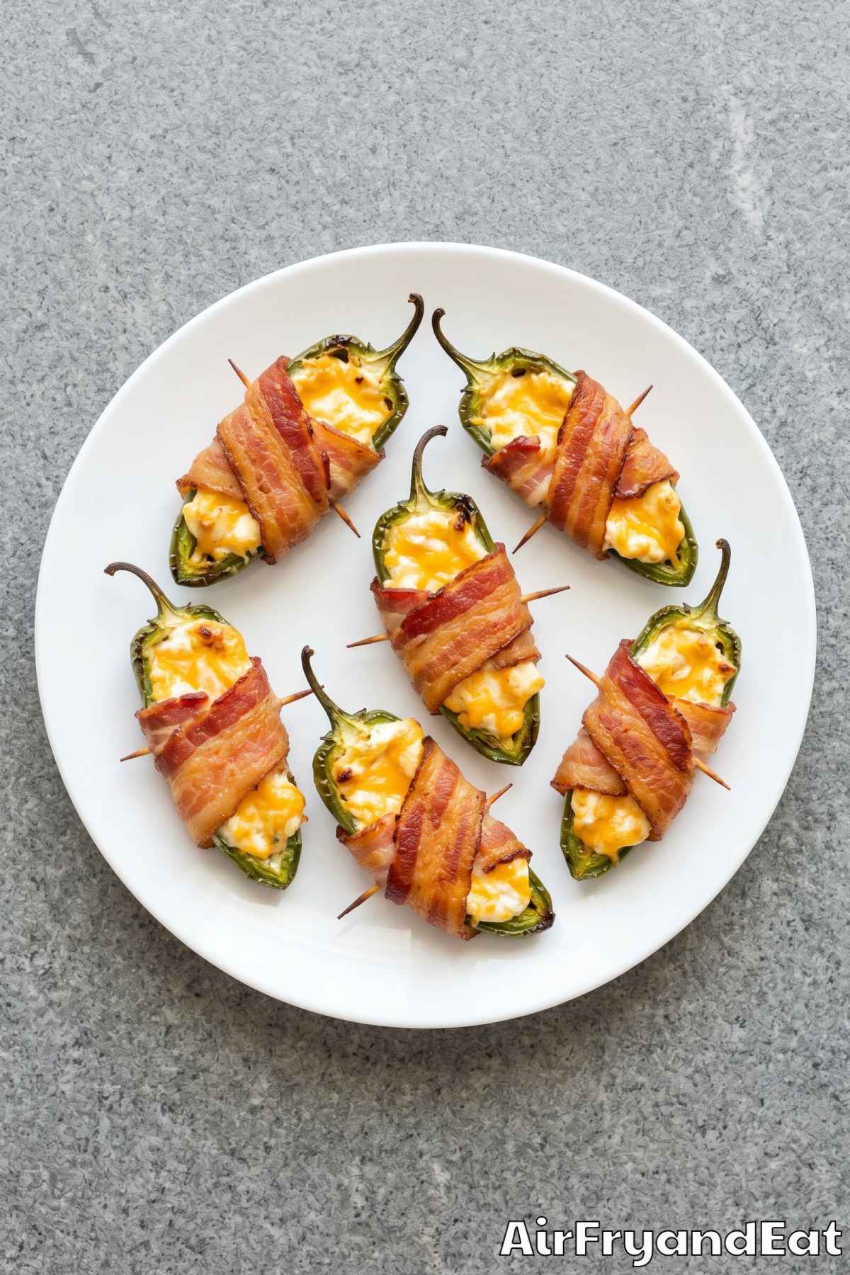golden bacon wrapped jalapeño poppers close up