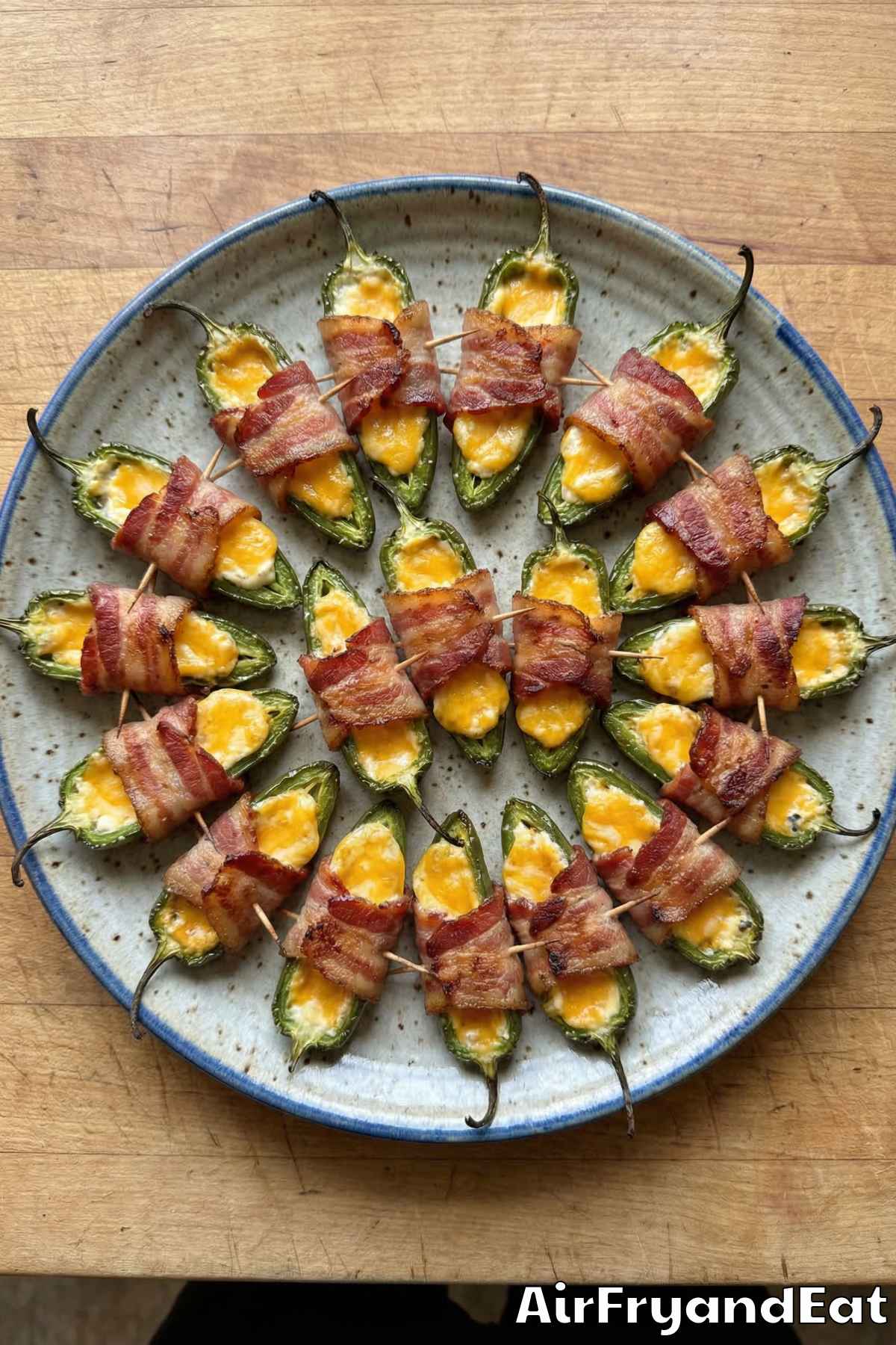 Cheesy air fryer bacon wrapped jalapeño poppers