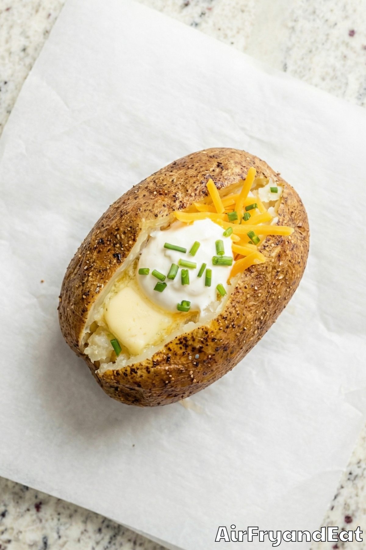 Hearty air fryer baked potatoes split open