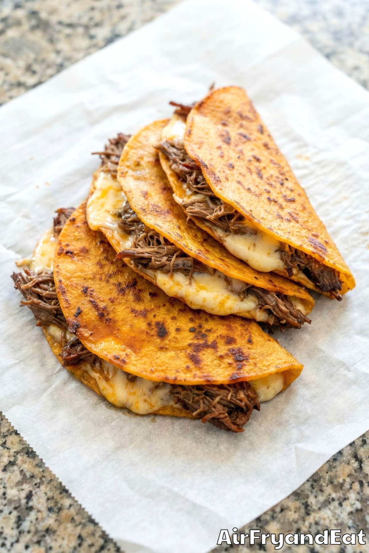 Homemade air fryer birria tacos with broth