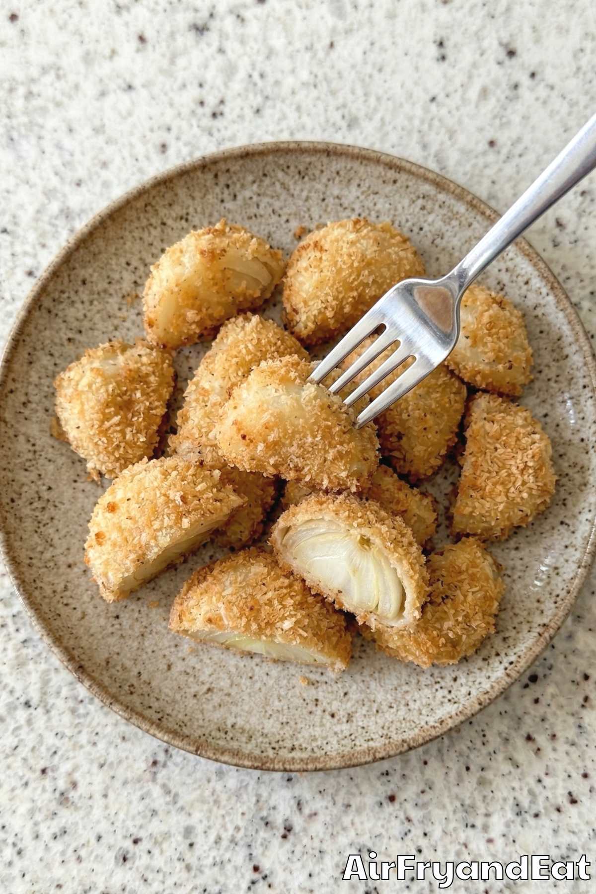 Tender air fryer blooming onion bites stacked