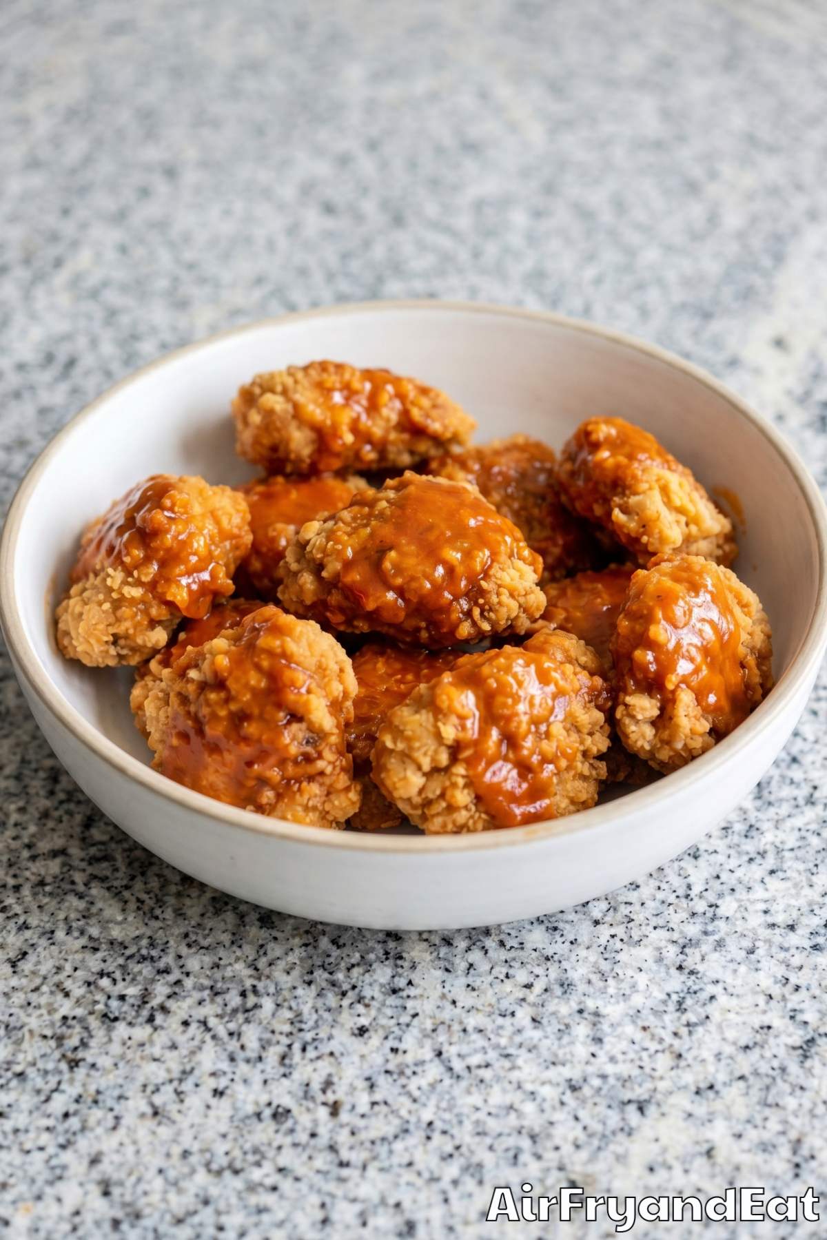 Crunchy air fryer boneless wings with sauce