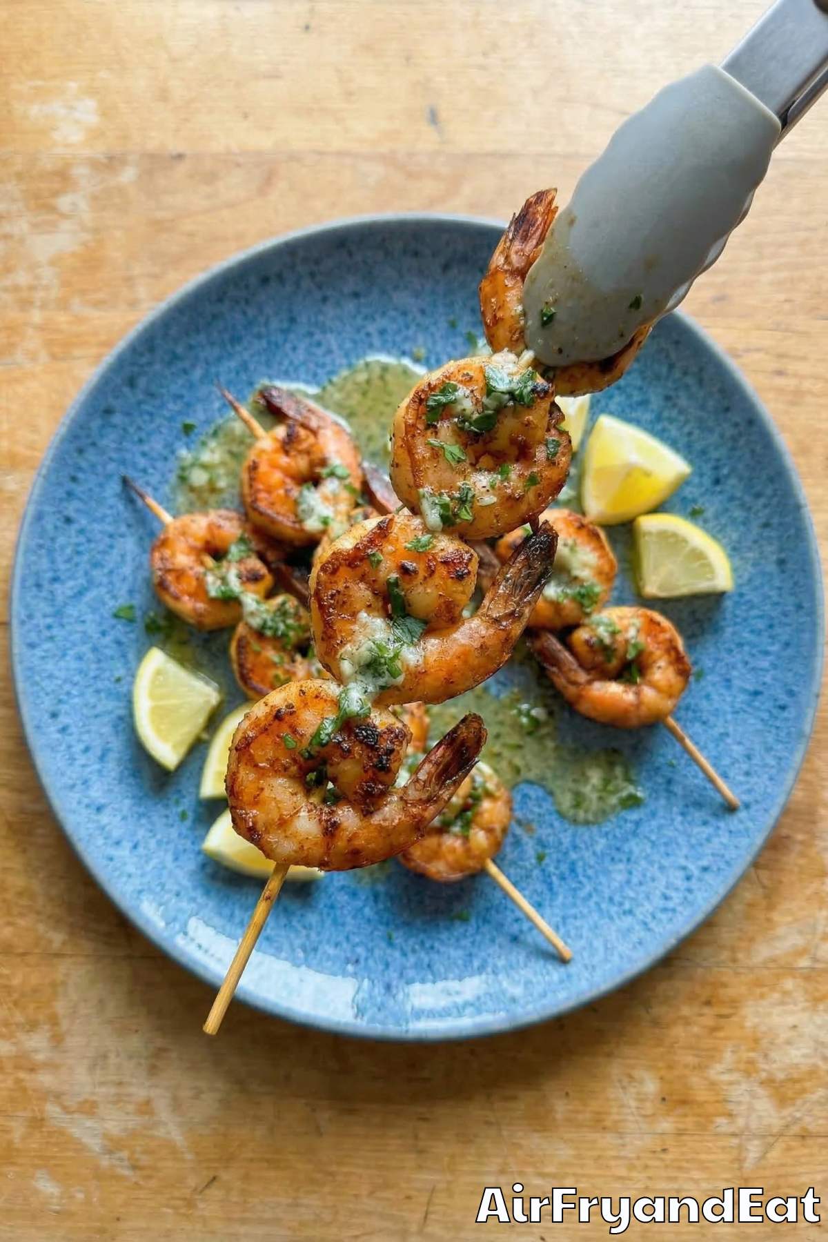 Savory air fryer Cajun shrimp skewers on a board