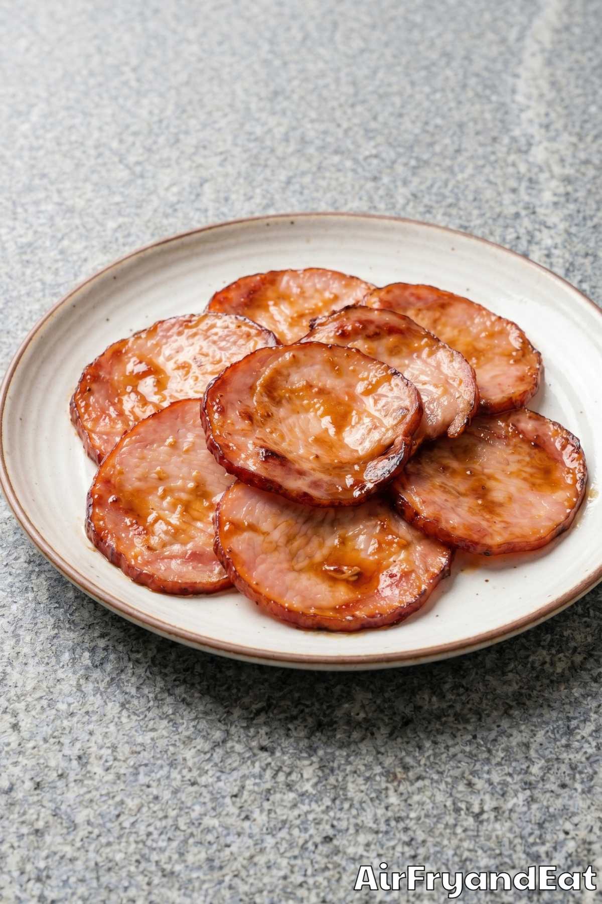 Warm air fryer Canadian bacon on a dish