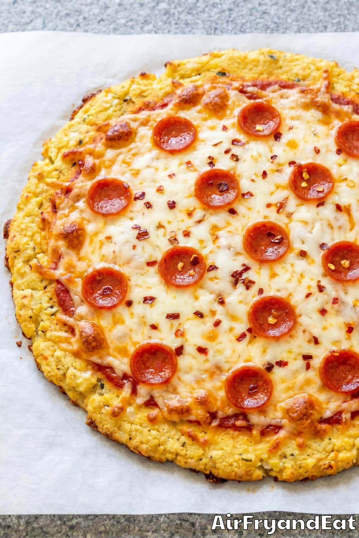 Golden air fryer cauliflower pizza closeup