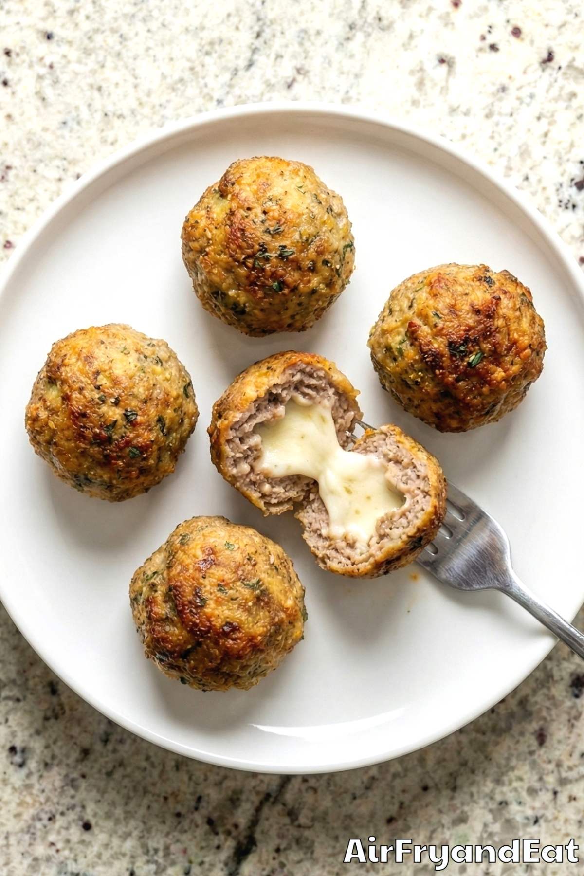 Tender air fryer cheesy stuffed meatballs