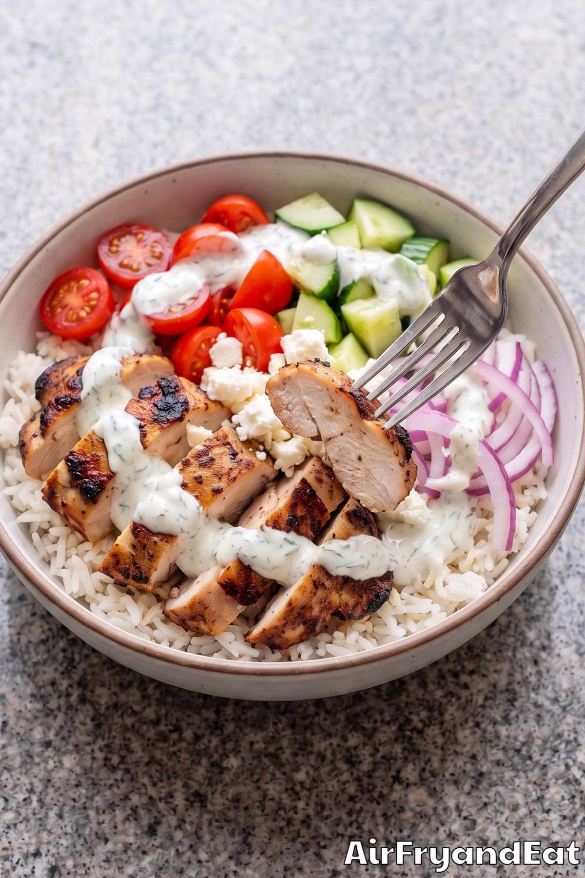 Tender chicken gyro bowl with tzatziki