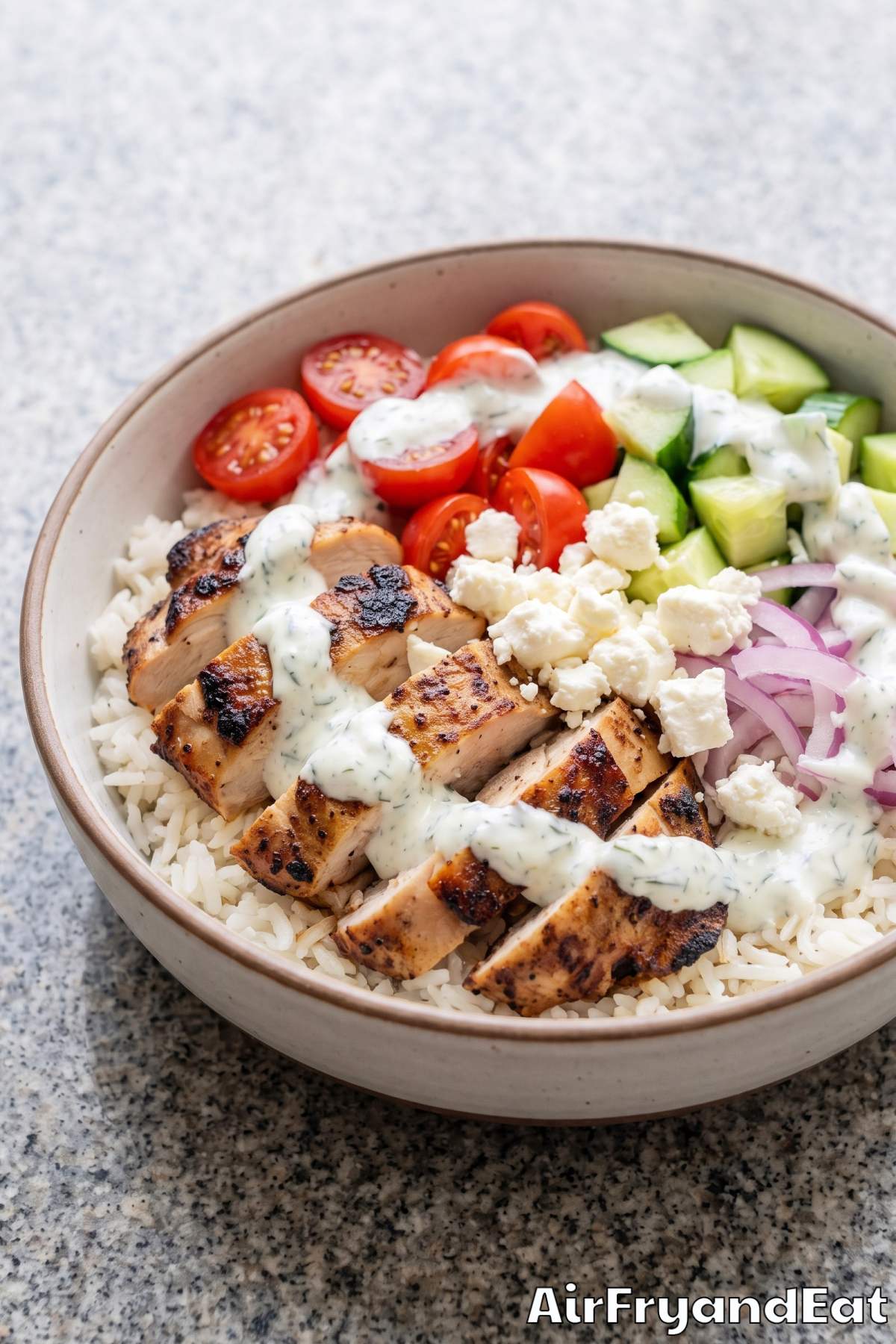 Fresh gyro chicken bowl with tomatoes