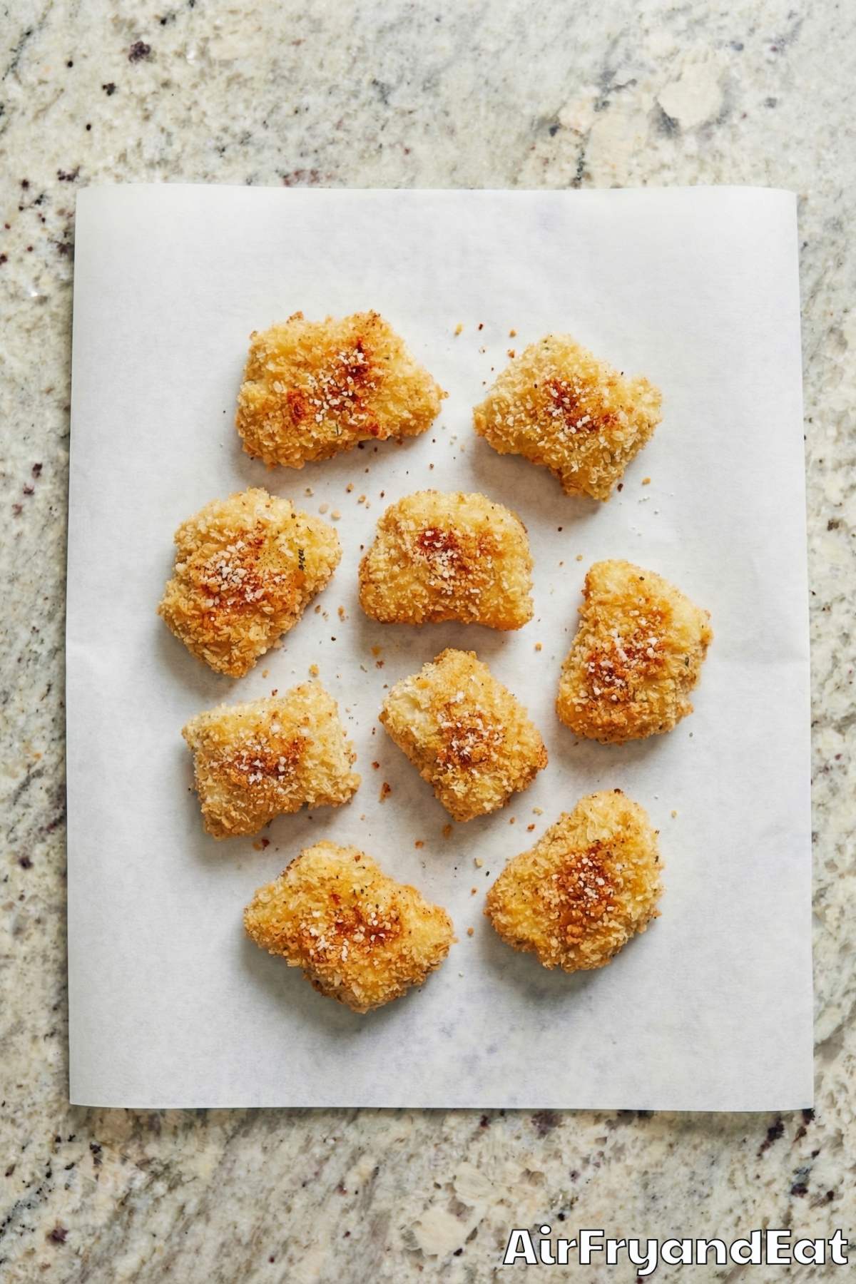 Savory air fryer chicken nuggets on parchment