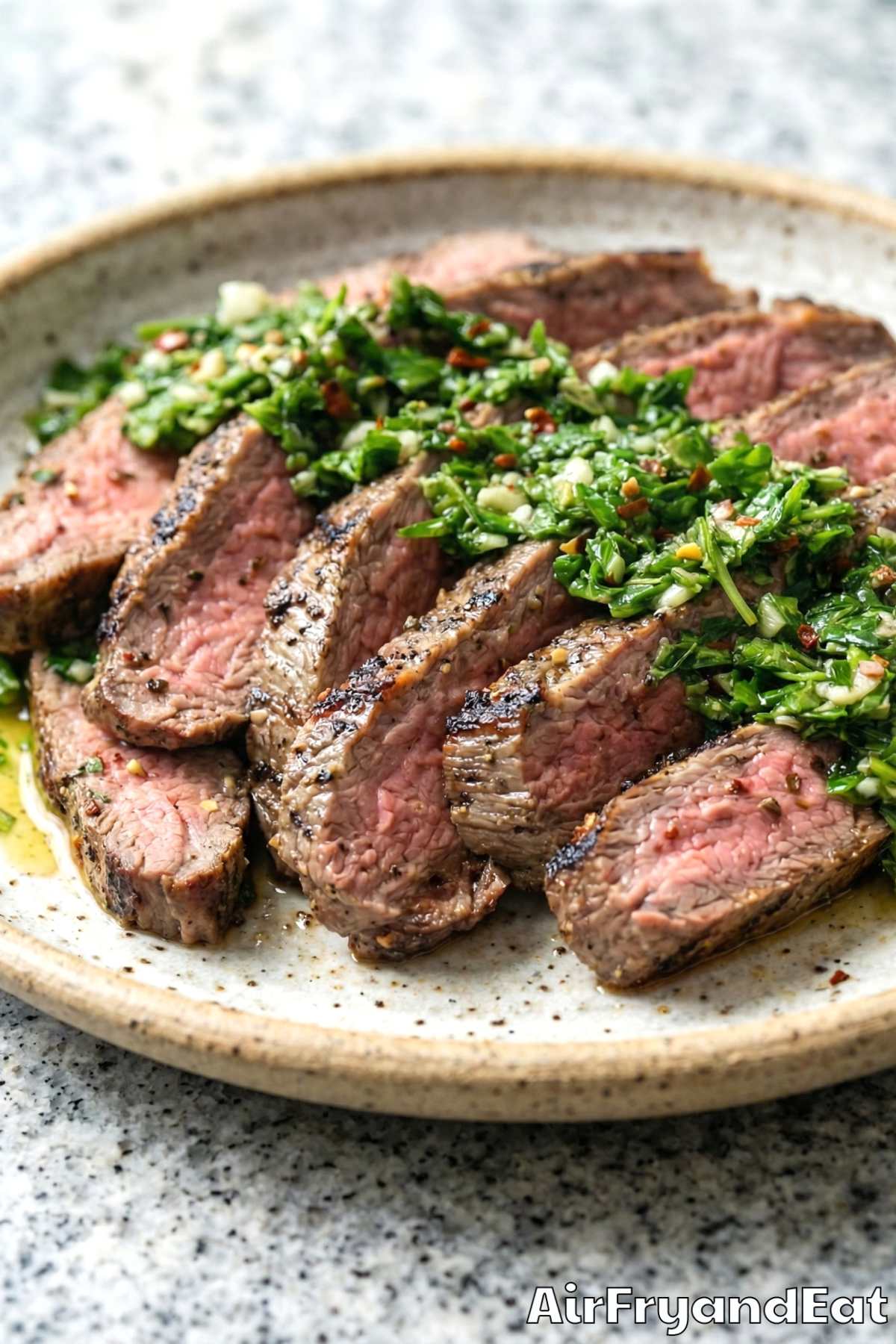 Herb-topped air fryer chimichurri flank steak