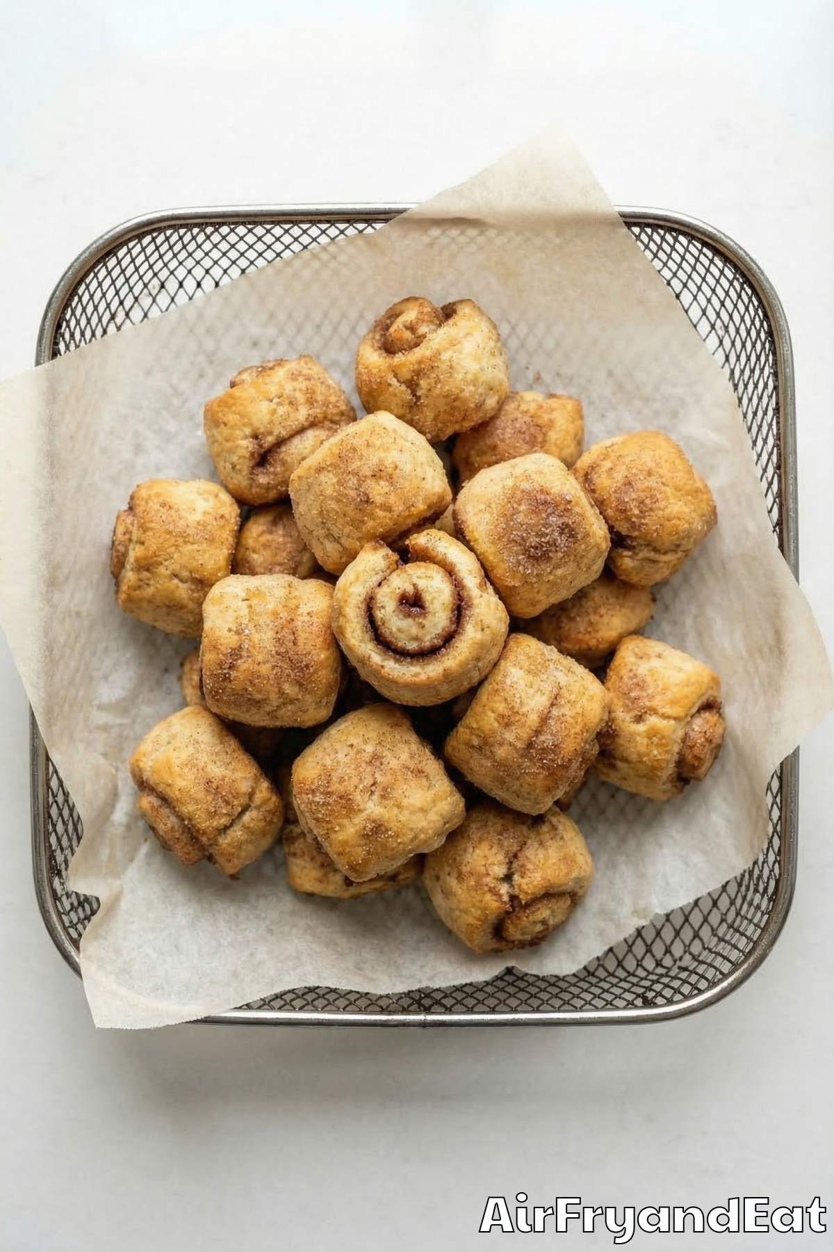 Fluffy air fryer cinnamon roll bites stacked up