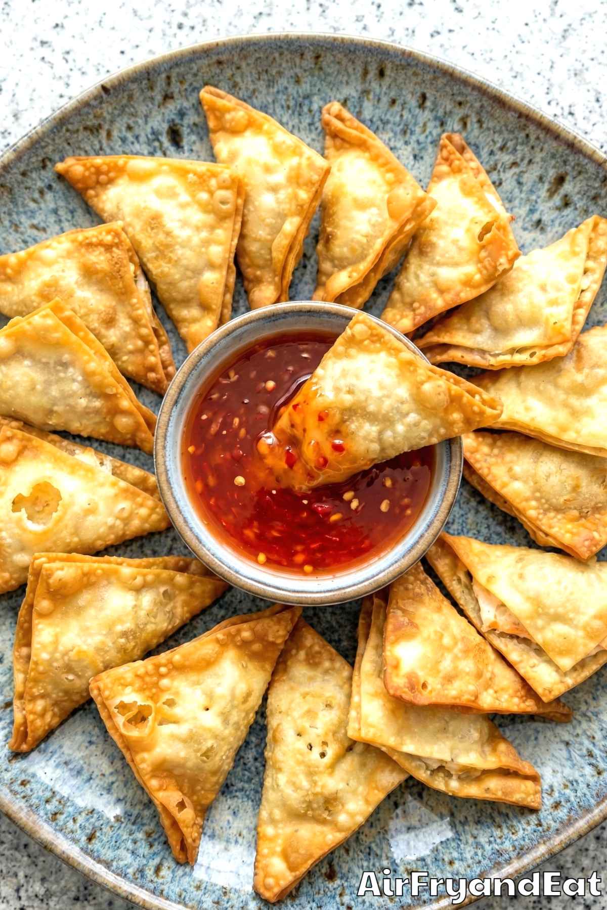 Homemade air fryer crab rangoon served warm