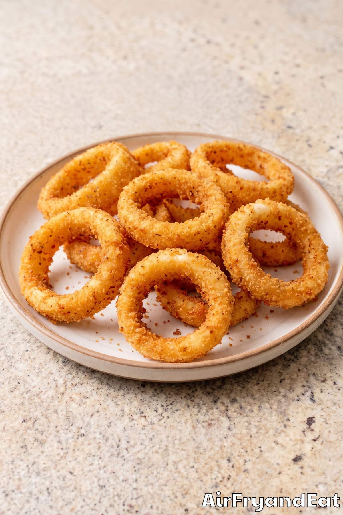 Golden panko onion rings stacked up