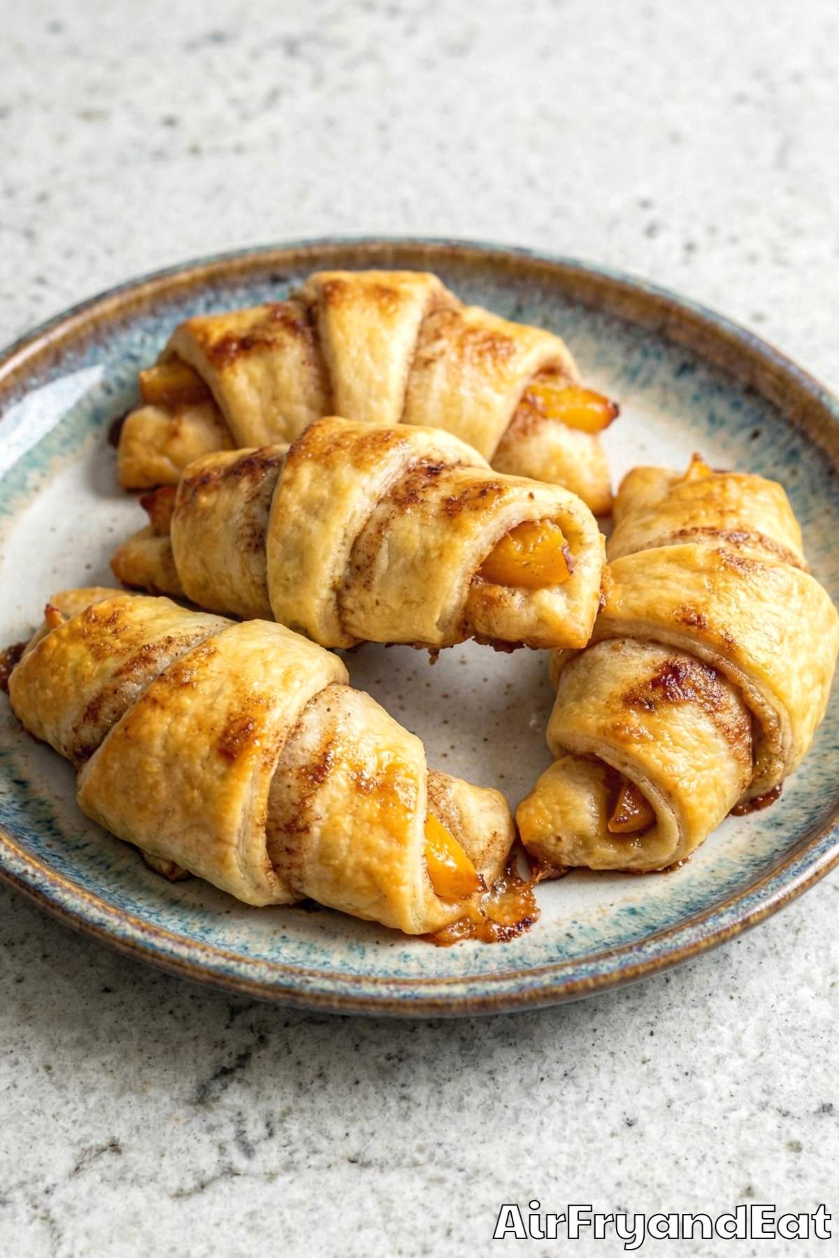 Easy air fryer crispy peach cobbler rolls