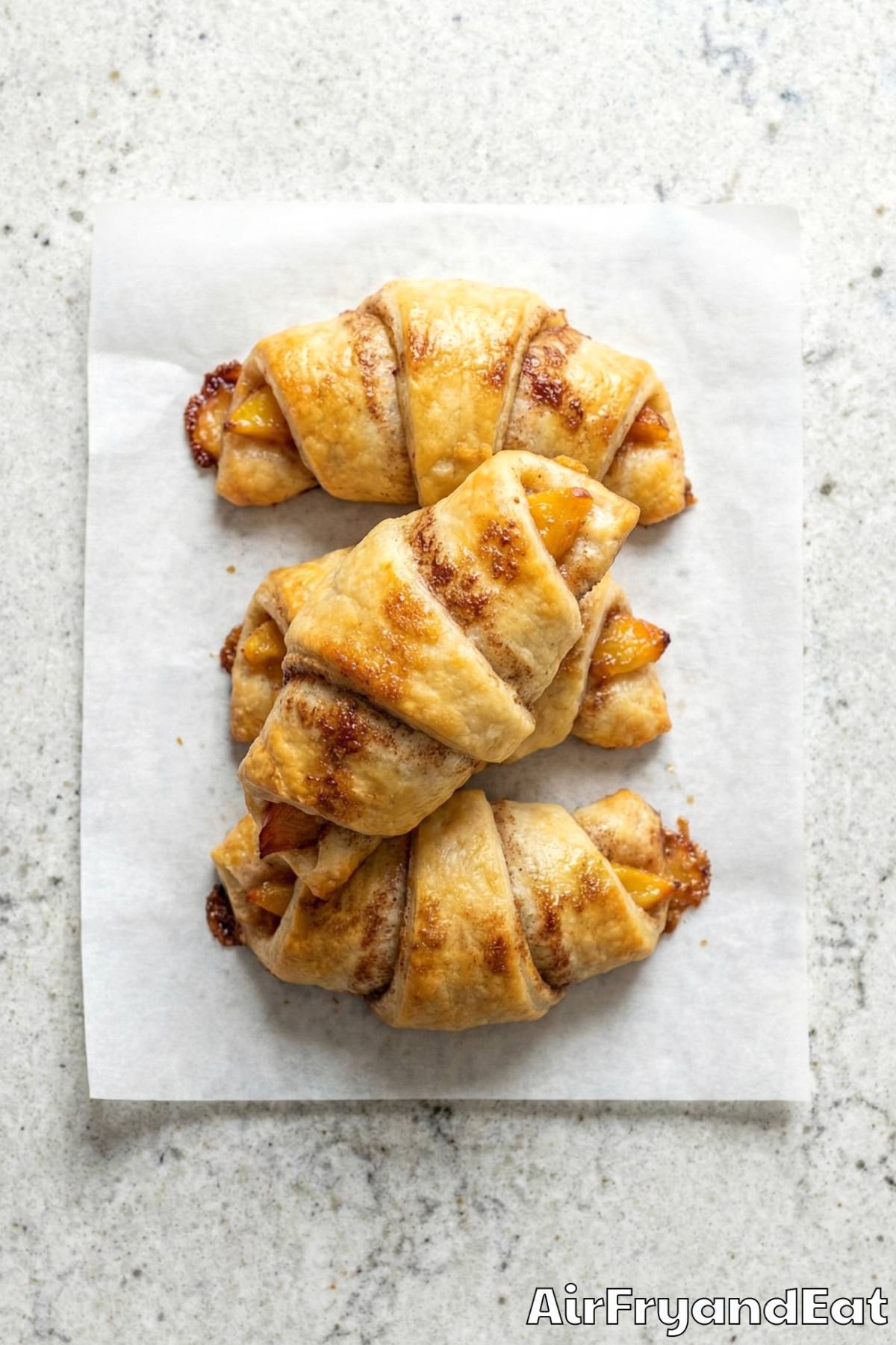 Decadent air fryer peach cobbler rolls served