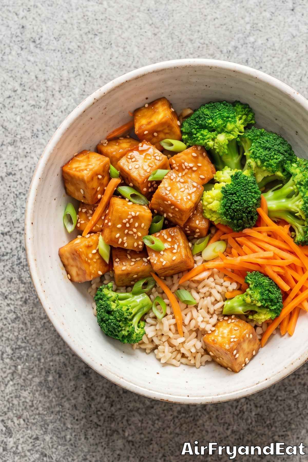 Crispy sesame tofu with rice and greens