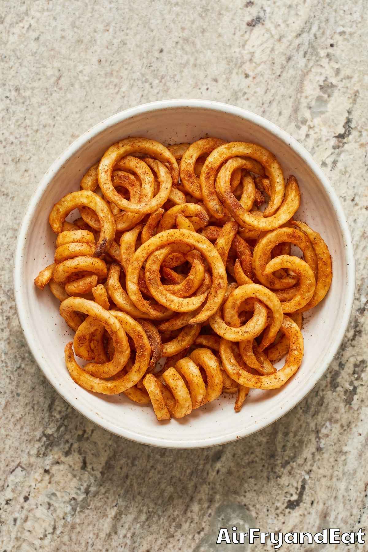 Savory air fryer curly fries piled high