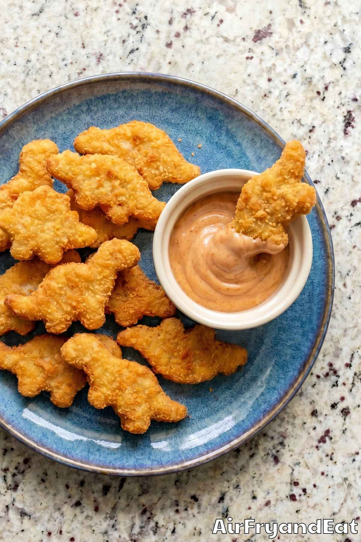 Golden air fryer dino nuggets close up