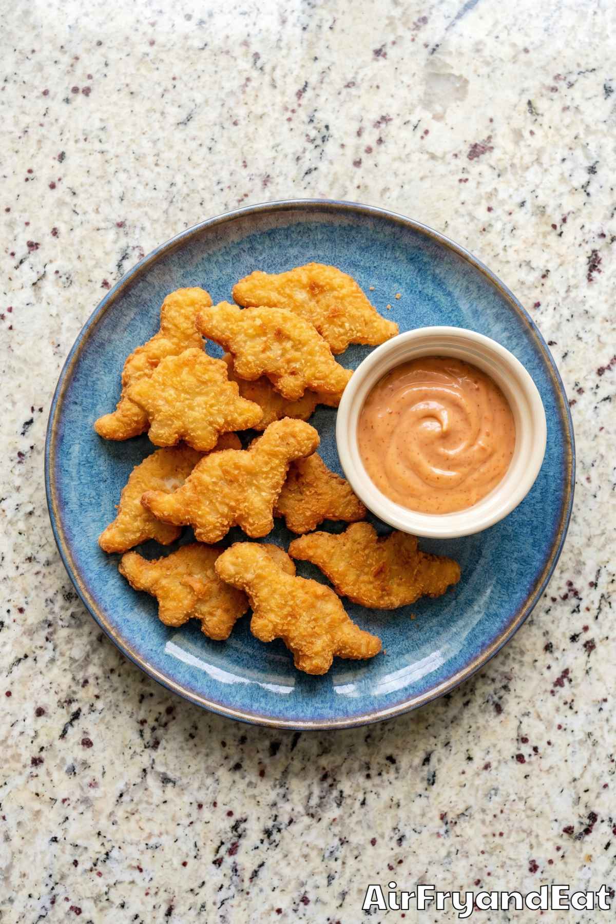 Crispy air fryer dino nuggets on a plate