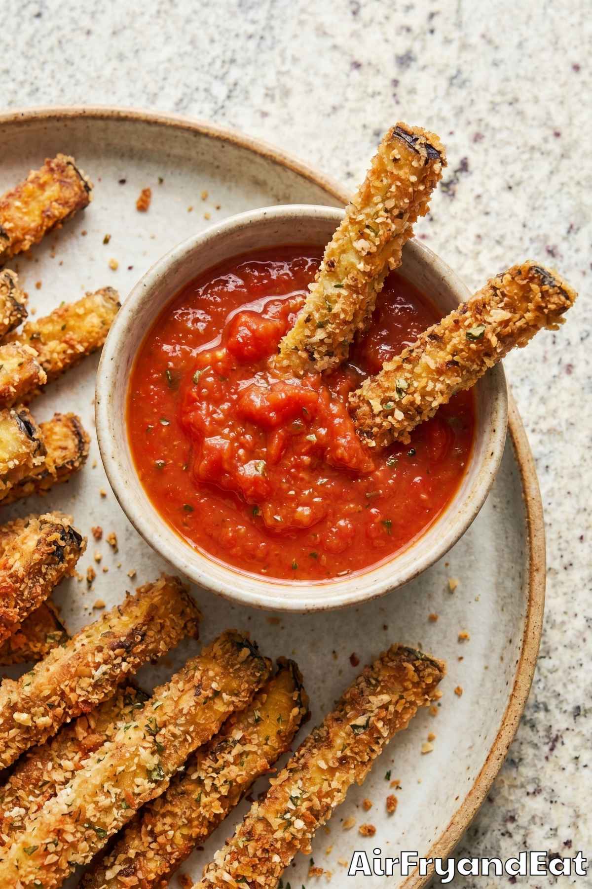 Golden air fryer eggplant fries close-up