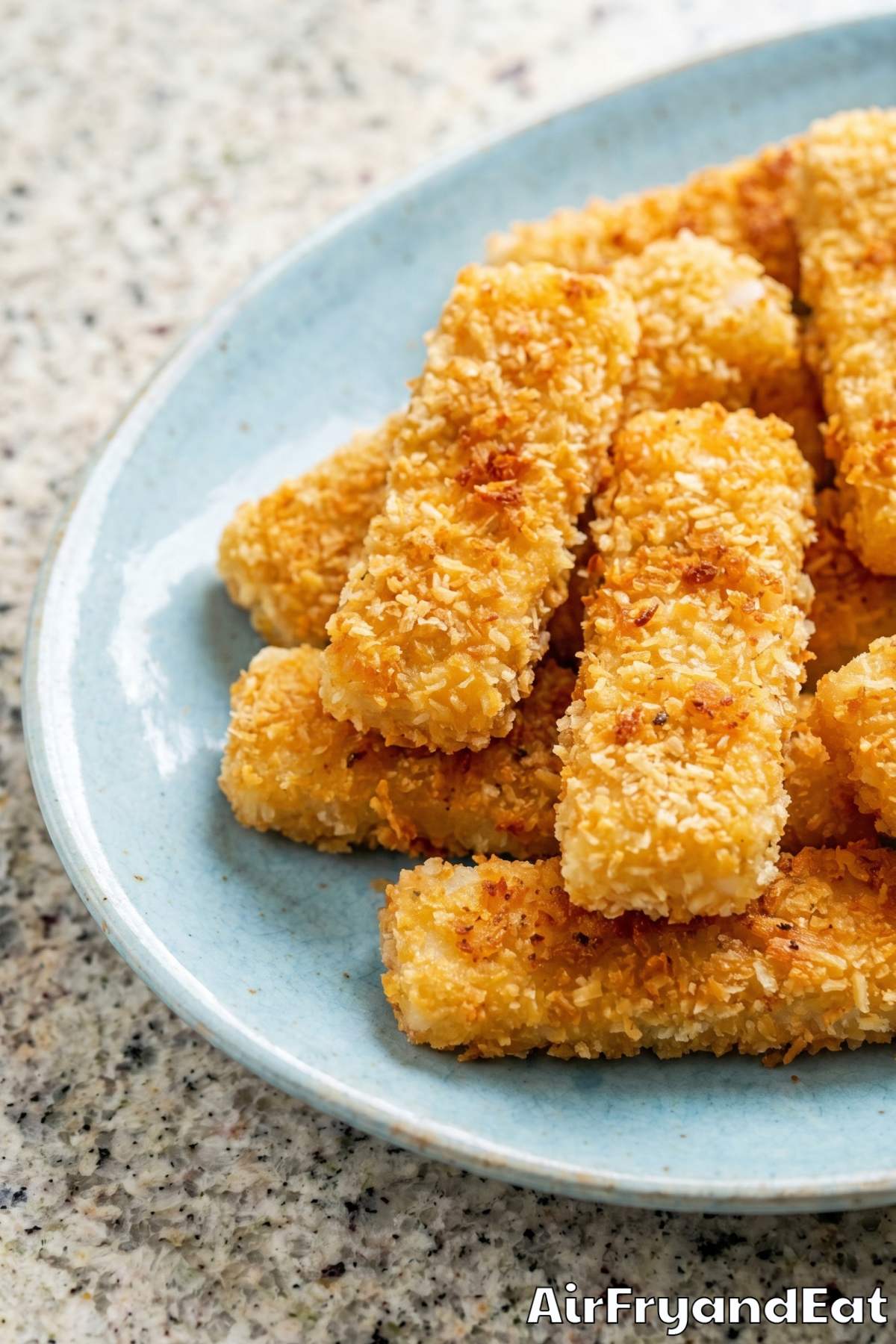 Golden air fryer fish sticks close up