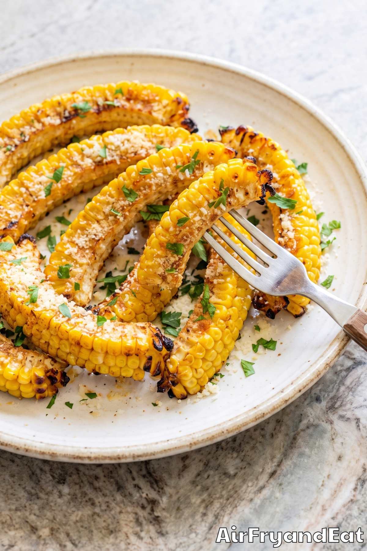 Crispy corn ribs topped with parmesan