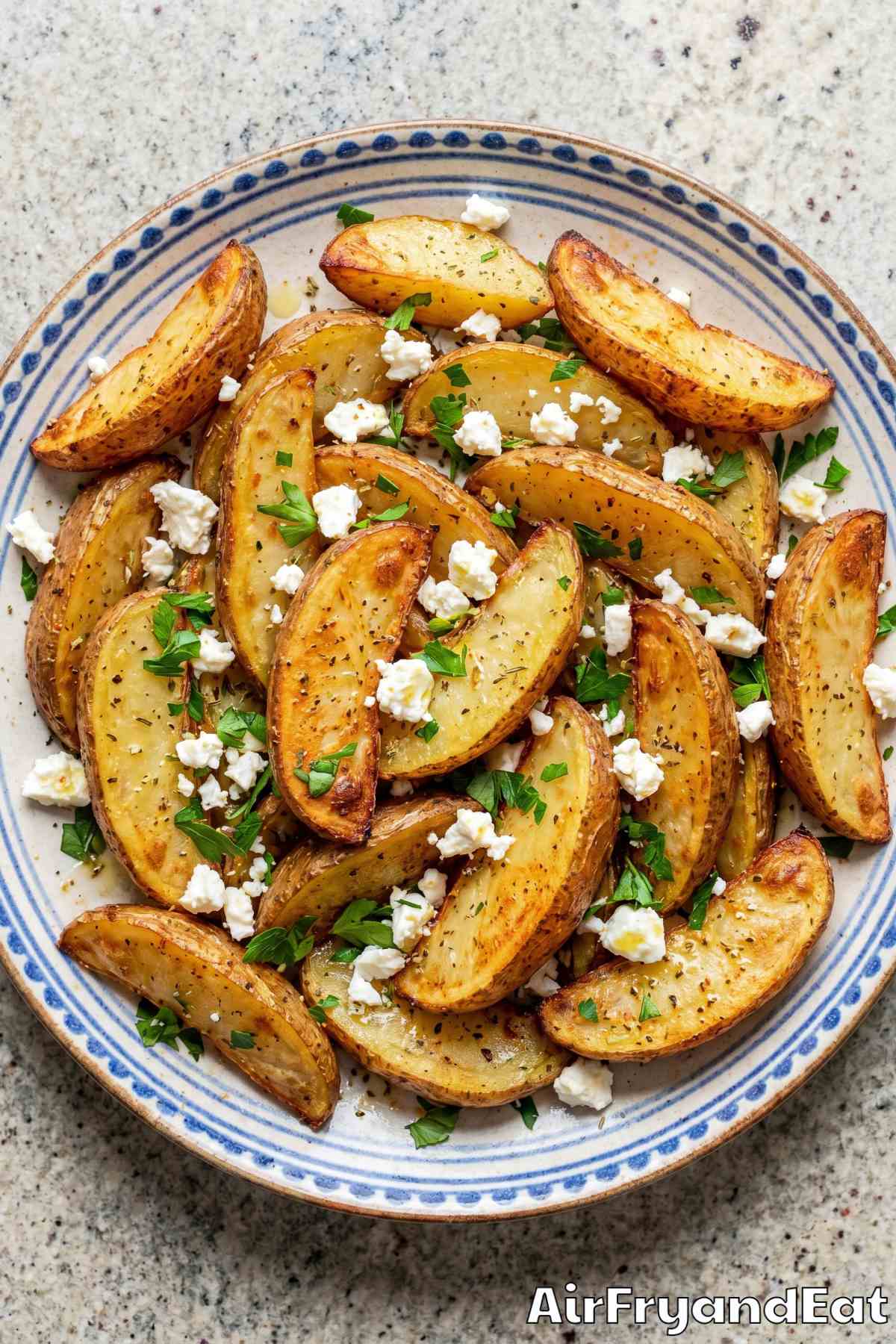 Golden air fryer Greek potatoes with herbs