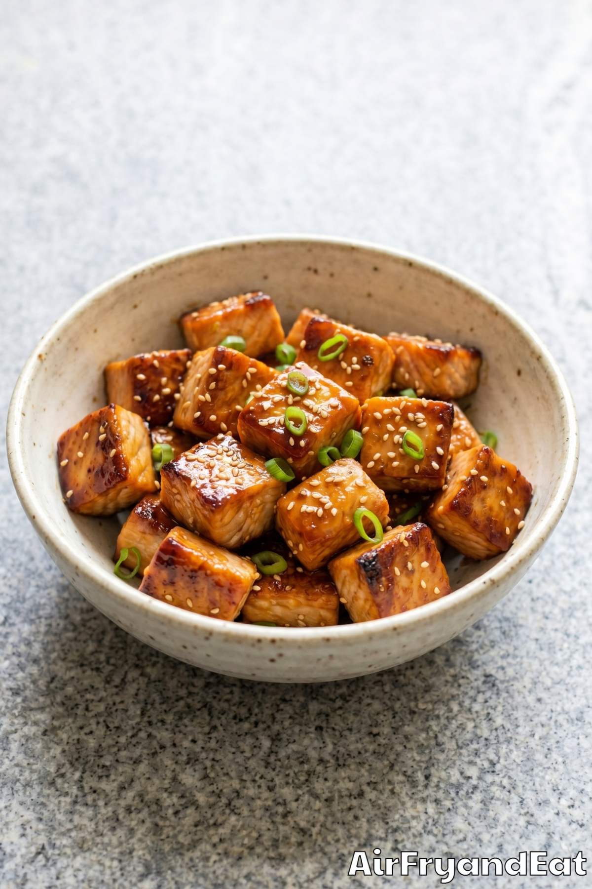 Irresistible glazed salmon bites on plate