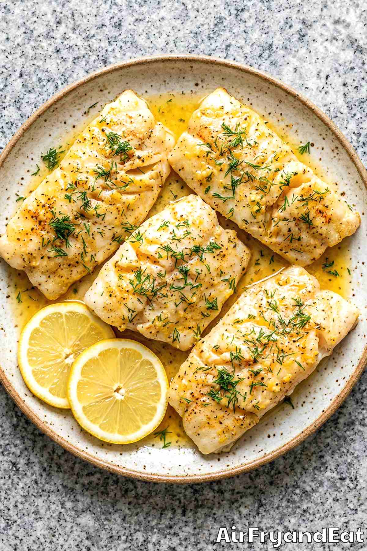 Easy air fryer lemon butter cod on a dish