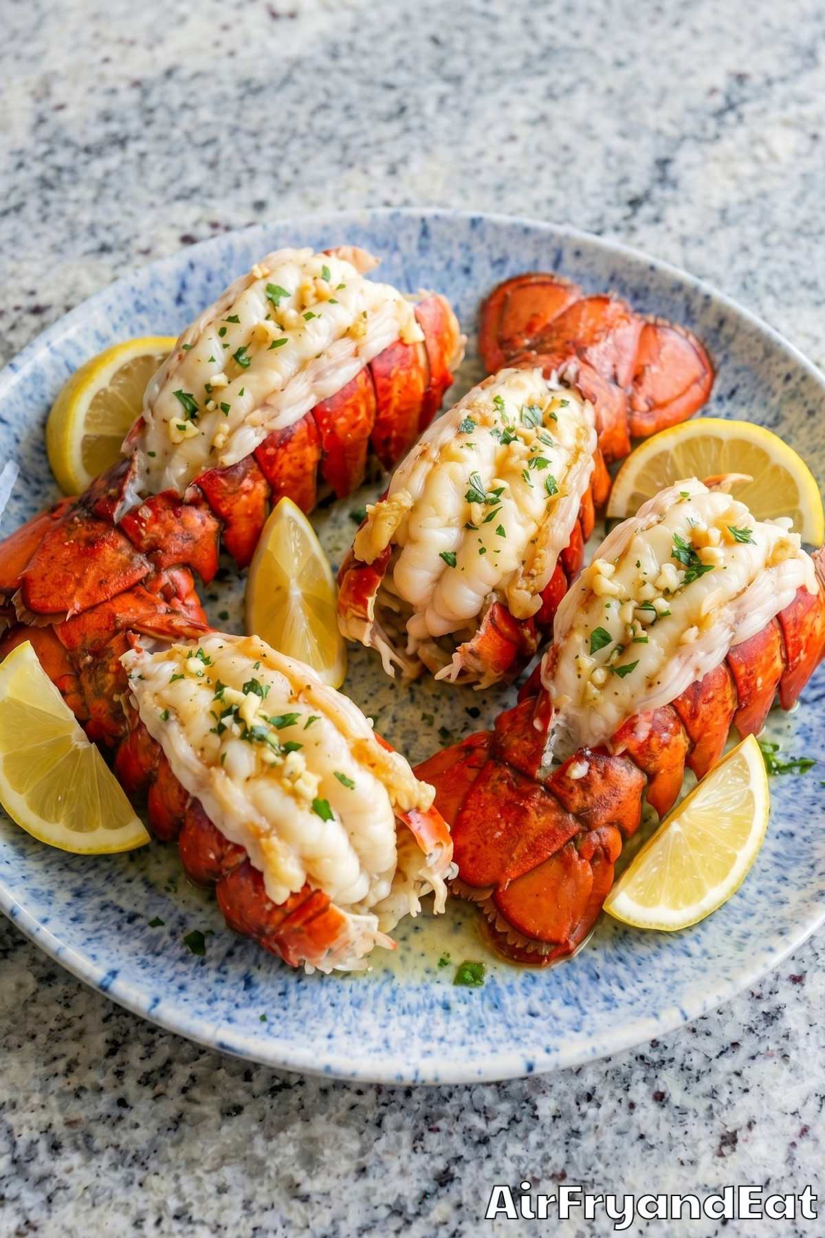 Golden air fryer lobster tails with lemon