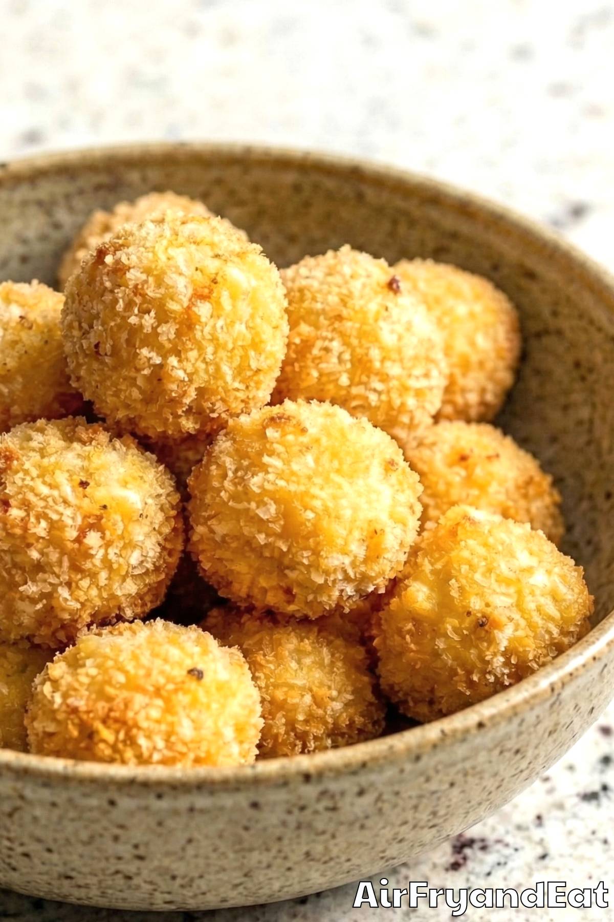 Creamy air fryer mac and cheese bites plated