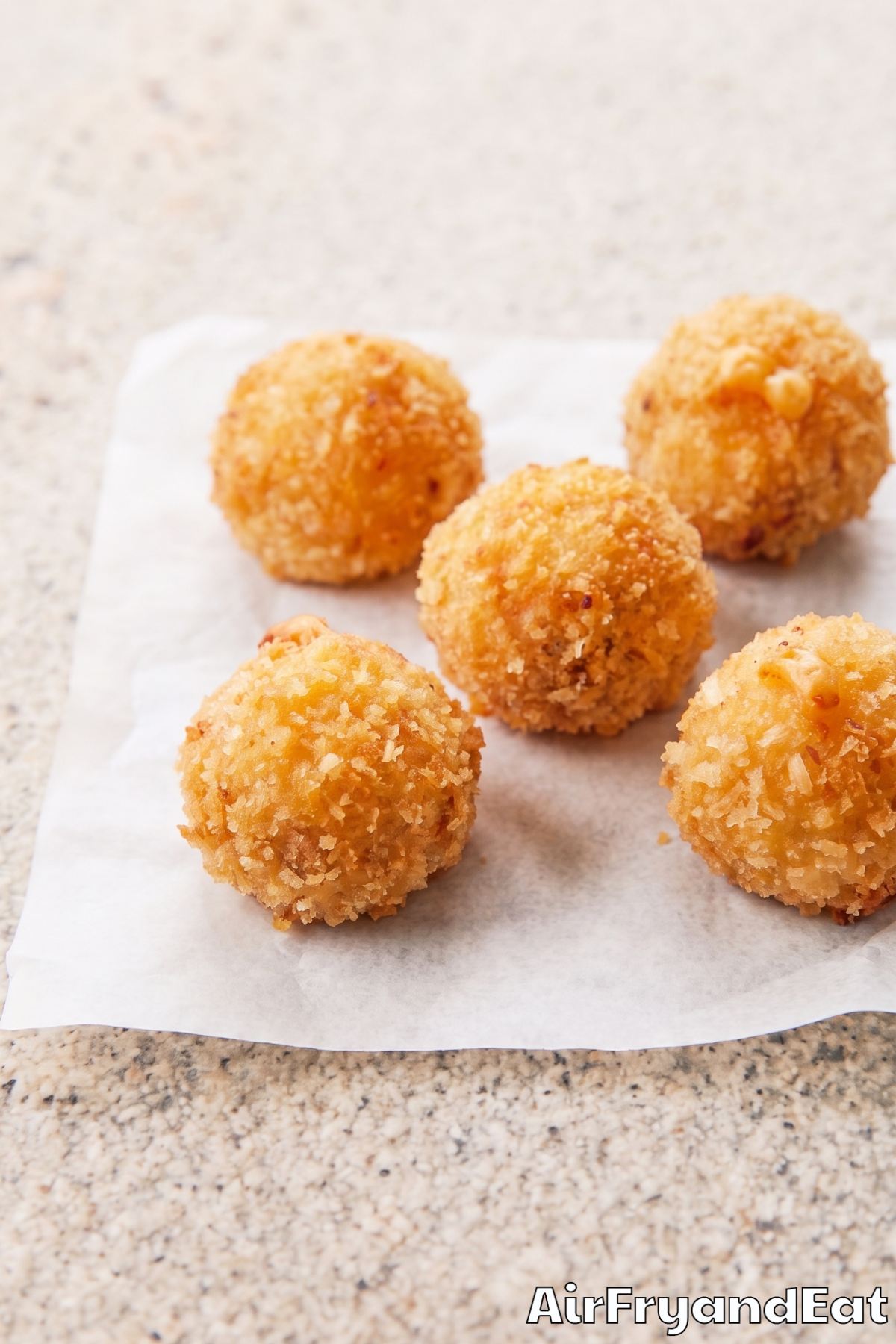 Cheesy mac bites fresh from fryer