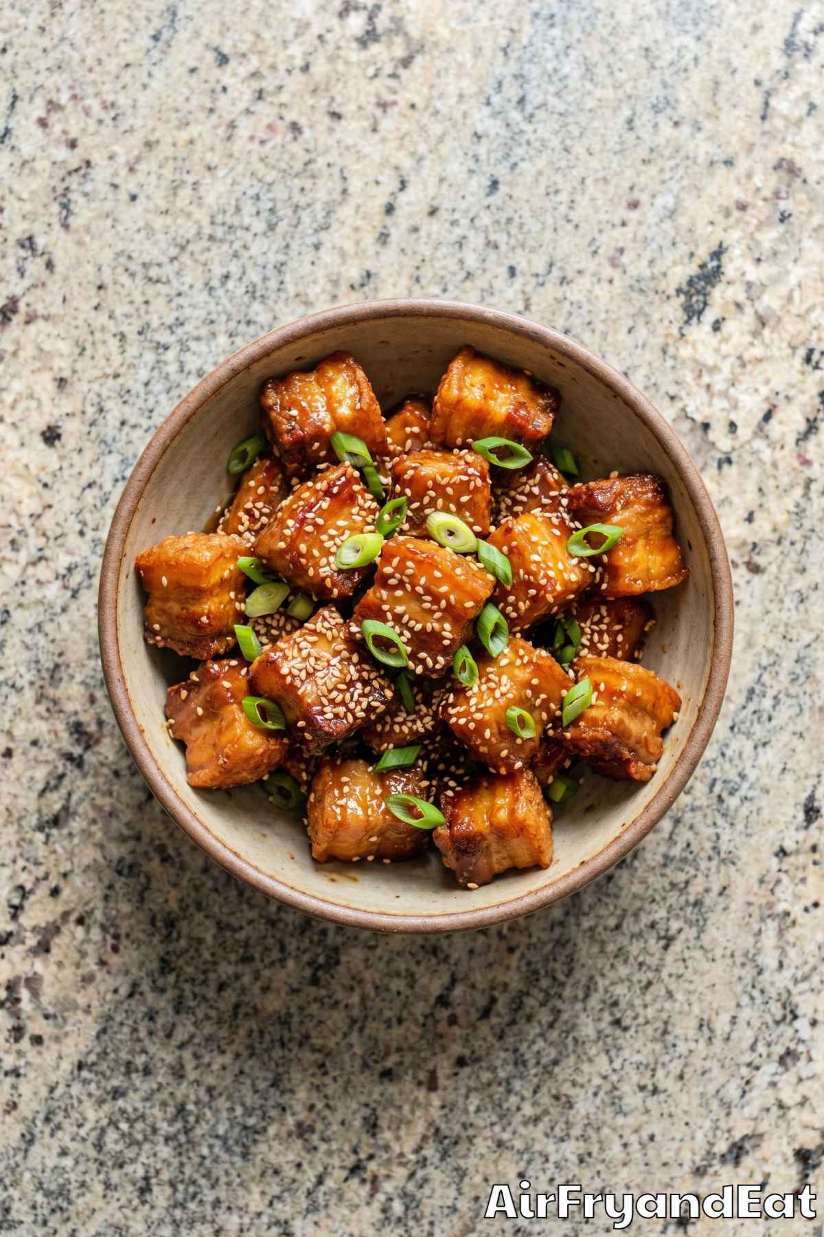 sticky maple pork belly bites on a plate