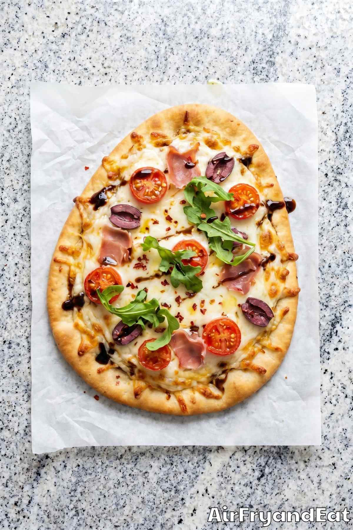 Cheesy air fryer naan pizza sliced