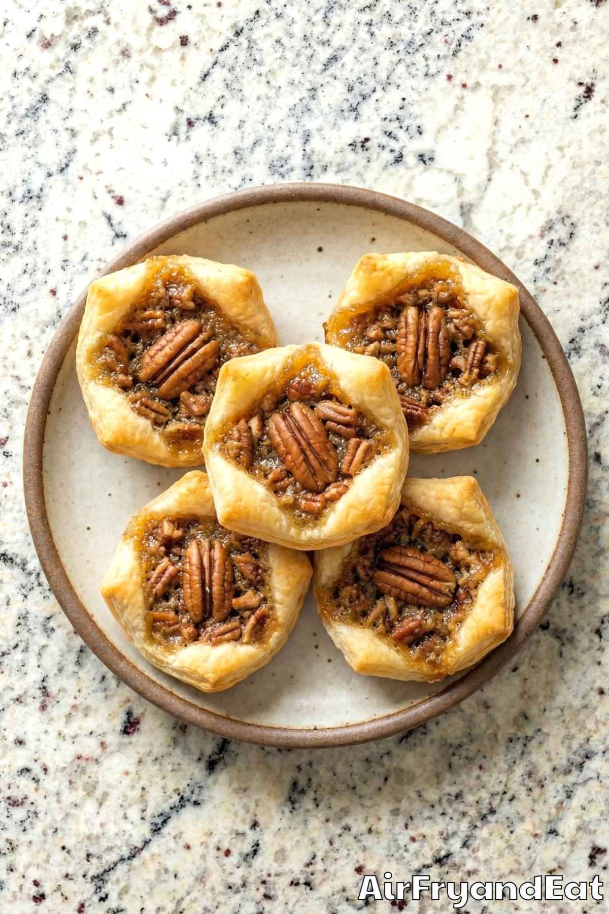 Homemade air fryer pecan pie bites on a rack