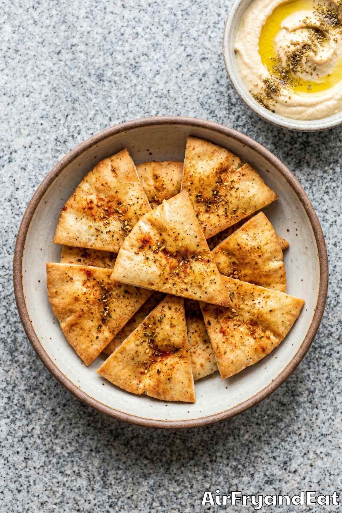 Seasoned air fryer pita chips in a bowl