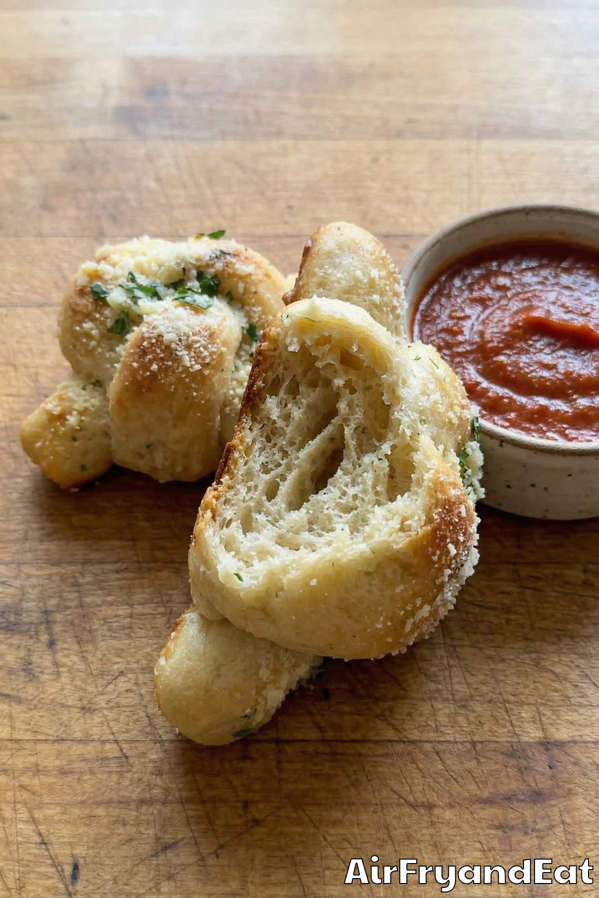 Crispy air fryer pizza dough knots with garlic butter