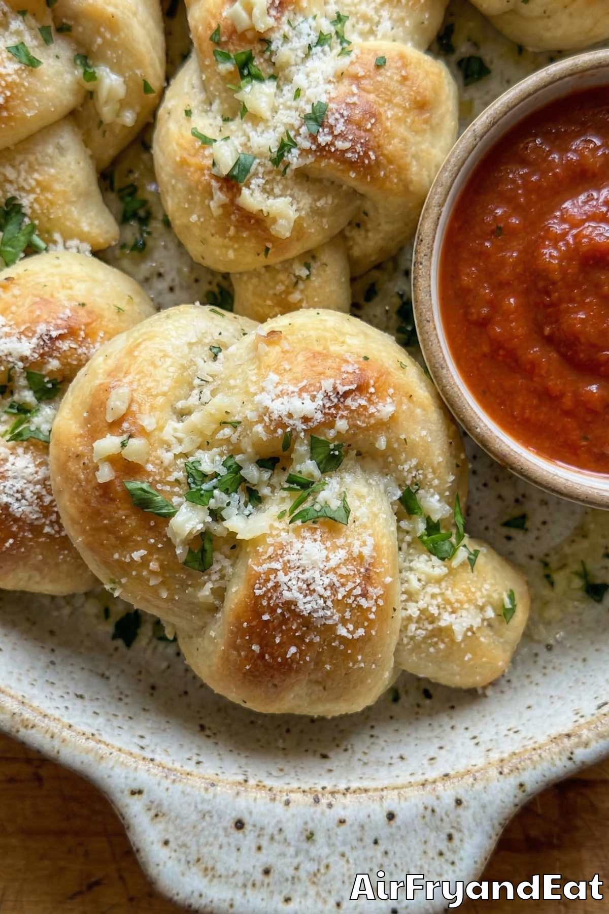 Soft pizza dough knots with rich garlic butter