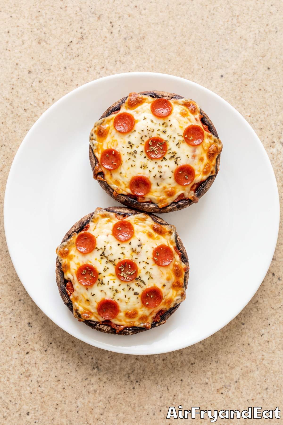 Golden pizza stuffed mushrooms on a plate