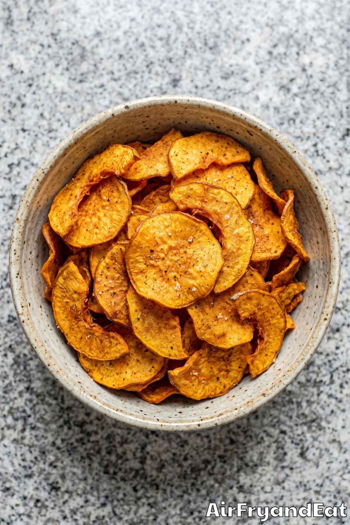 Savory air fryer pumpkin chips in a bowl