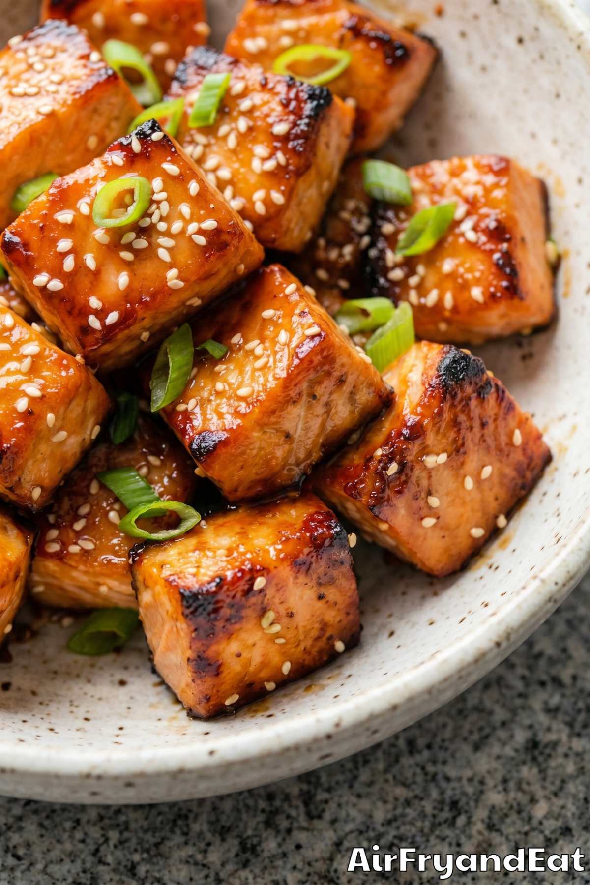 Flavorful air fryer salmon bites stacked up