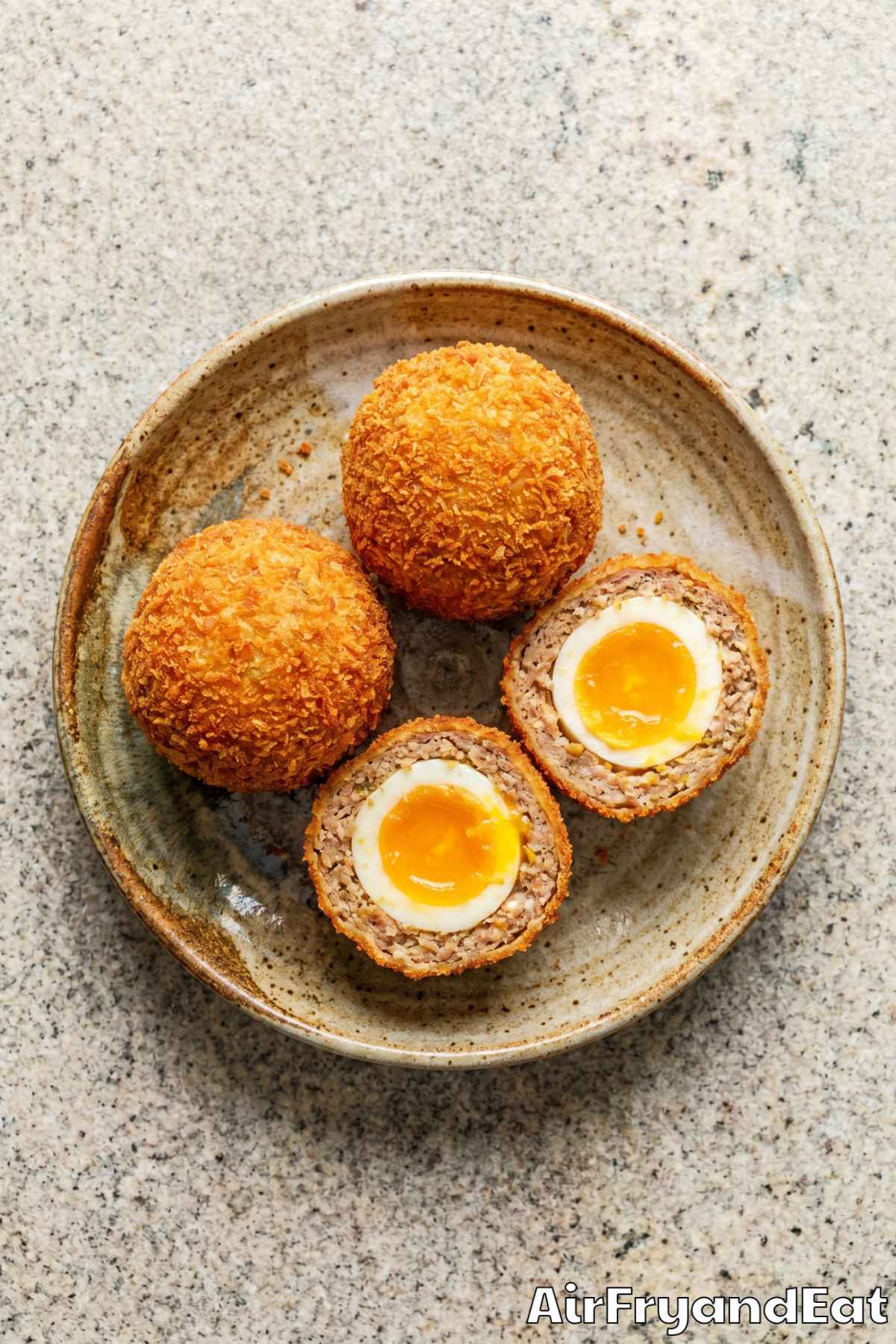 Crunchy air fryer Scotch eggs cut in half