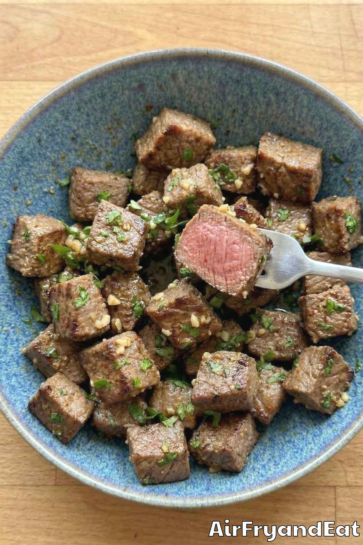 Golden air fryer steak bites with garlic butter