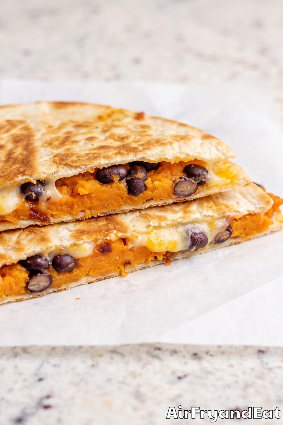 Cheesy sweet potato quesadillas cut open