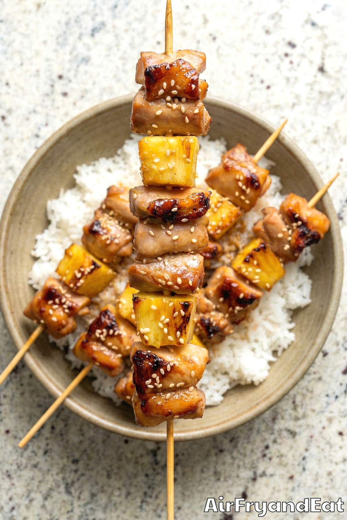 Sweet teriyaki pineapple chicken skewers on plate