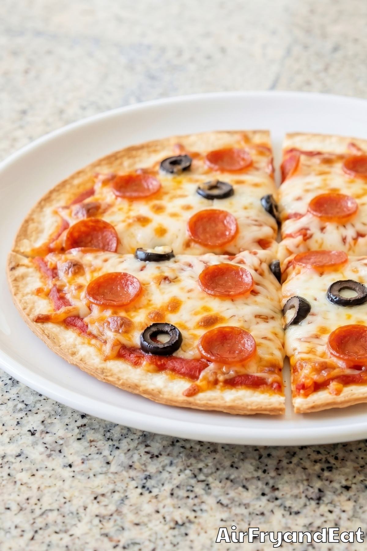 Homemade air fryer tortilla pizza sliced