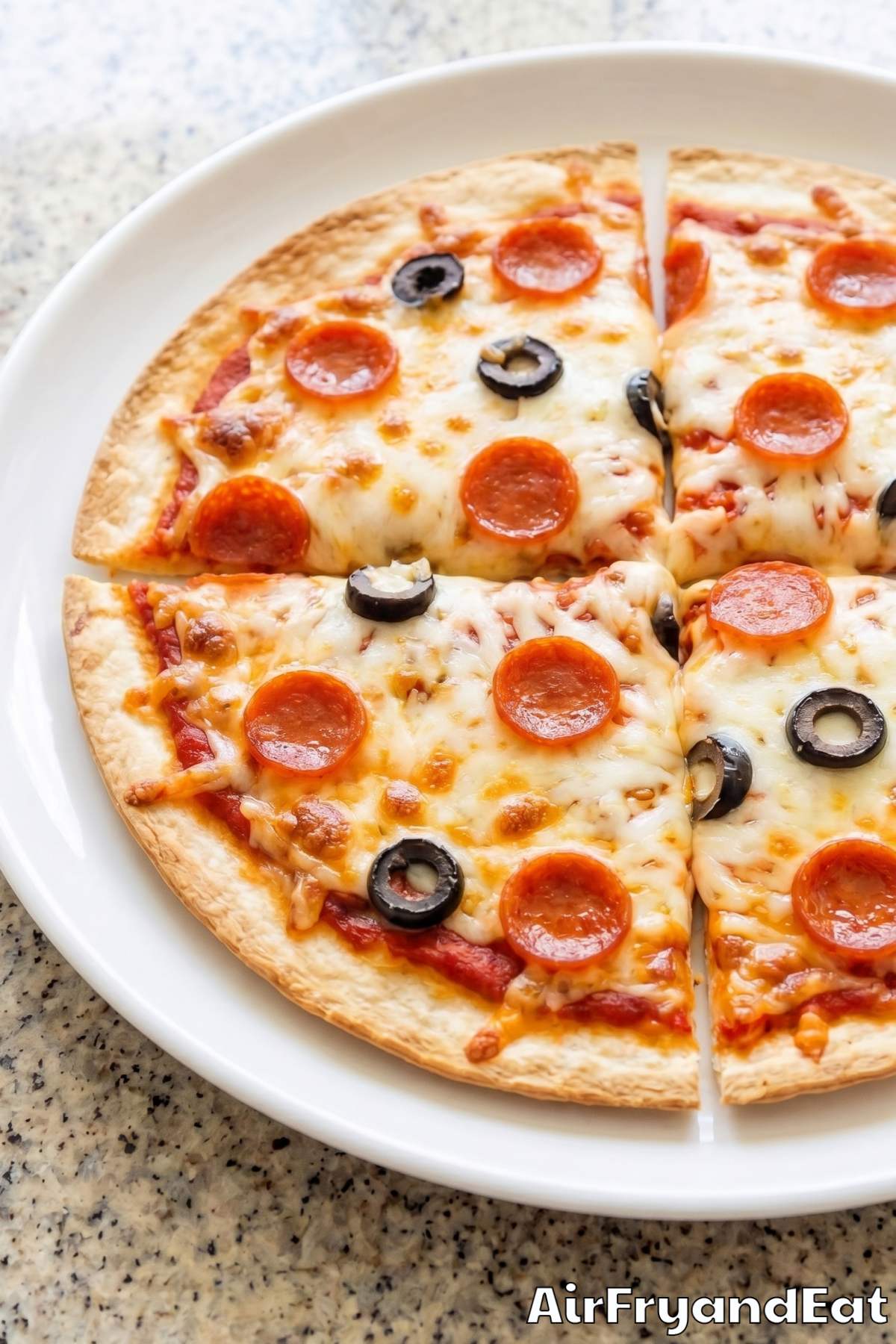 Crunchy air fryer tortilla pizza with toppings