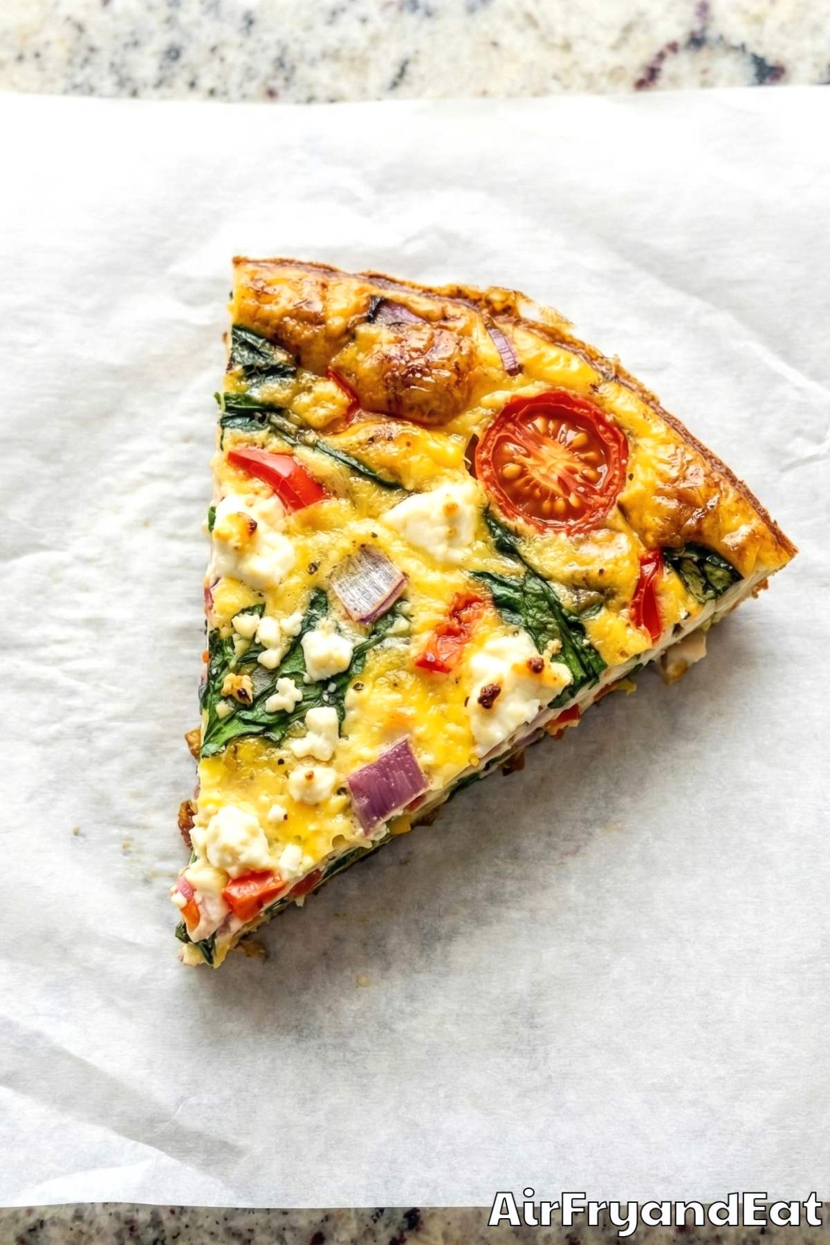 Colorful air fryer veggie frittata slice