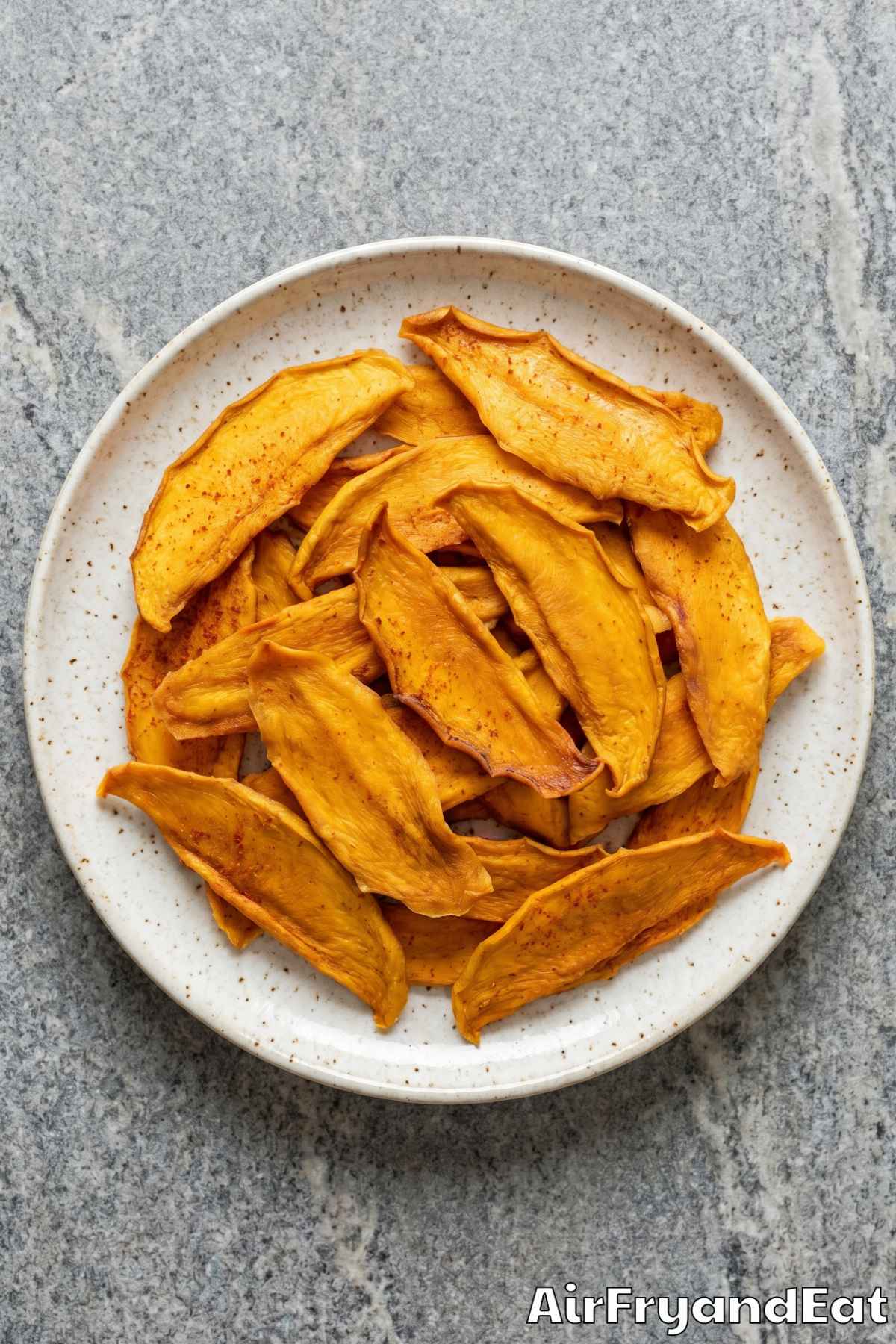 Golden mango dehydrating in air fryer